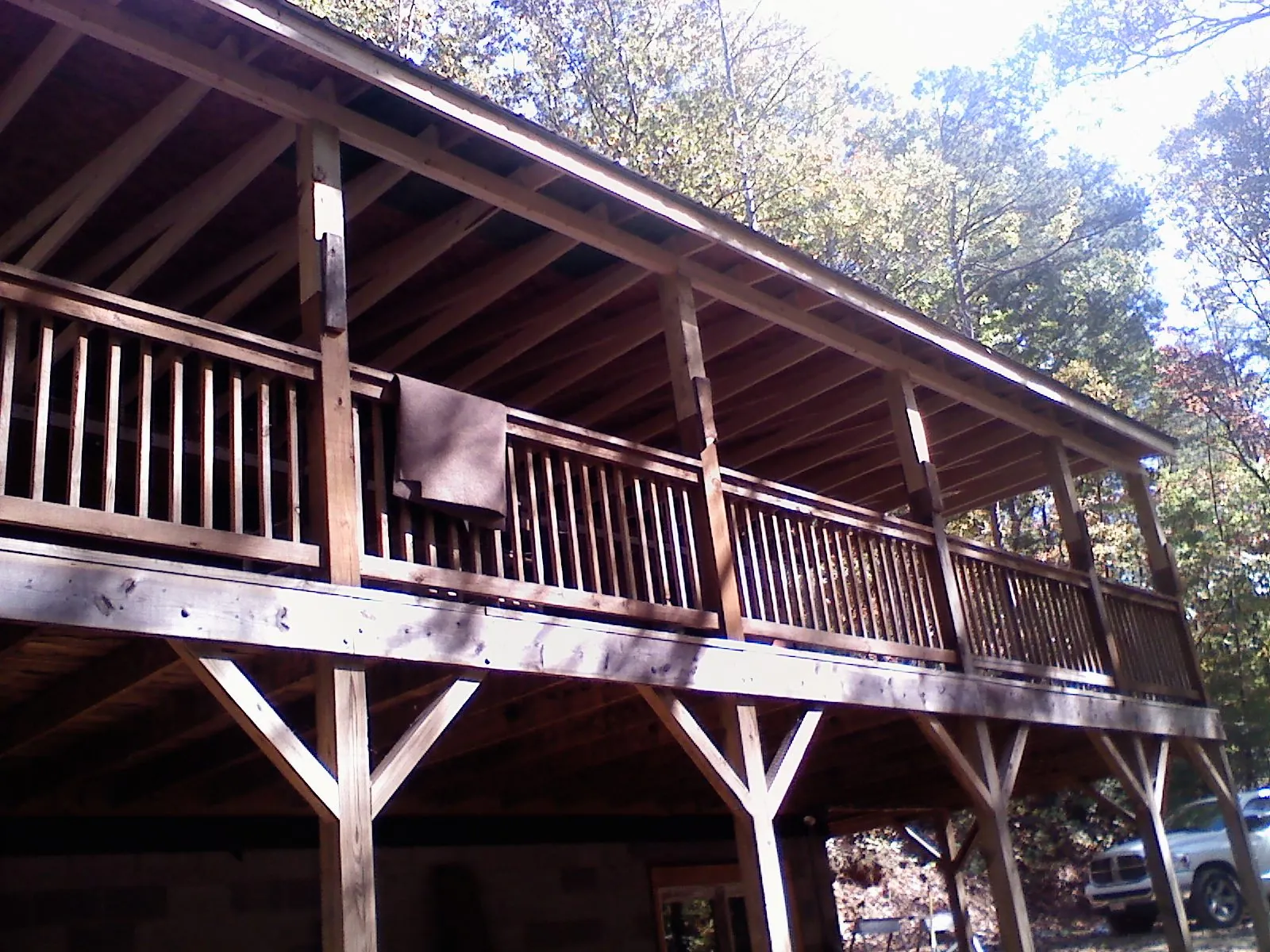 Timber framing under a new elevated porch and deck — Roof Leak Repair in North Fairfield by Roofing Brothers